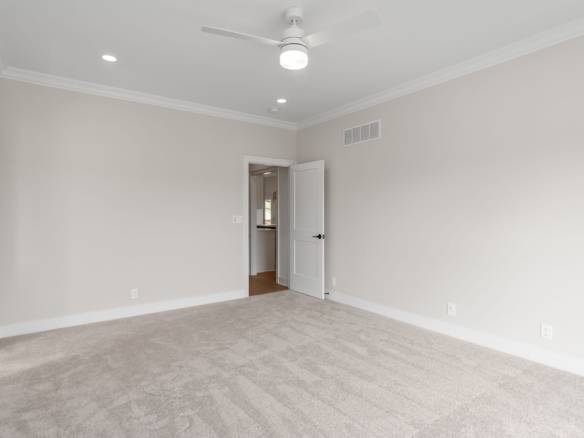 Interior living room with neutral walls and plush carpet at 5609 Morningside Drive.
