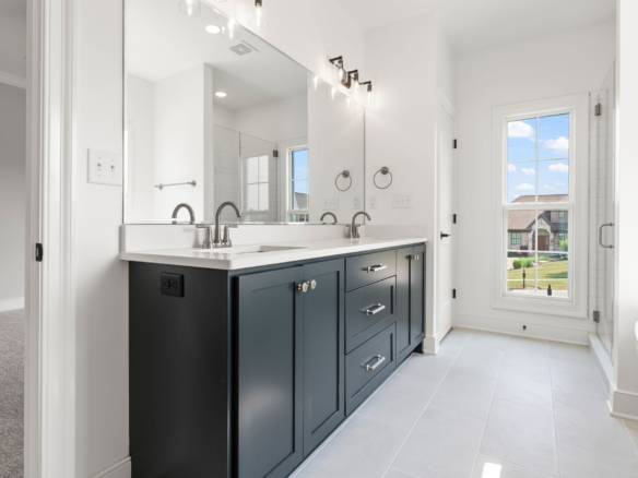 Bathroom vanity with dual sinks and ample storage.