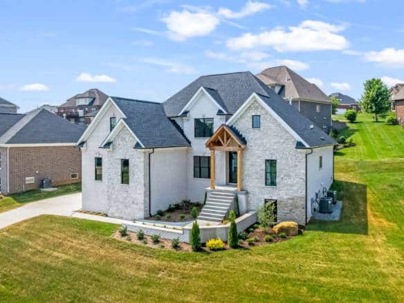 Elegant custom home with landscaped yard at 5611 Morningside Drive.