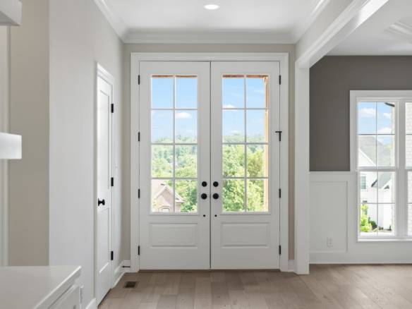 Elegant interior door design with large glass panels allowing natural light at 5611 Morningside Driv.