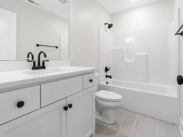 Bright, clean bathroom featuring a white vanity, black fixtures, and a bathtub with shower.