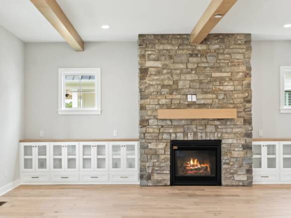 Fireplace with stone surround in a contemporary living space.