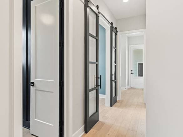 Interior doors with sleek black and white finishes in a contemporary home.
