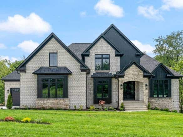 Beautiful custom-built house with brick and black accents at 11105 Craigs Creek Court.