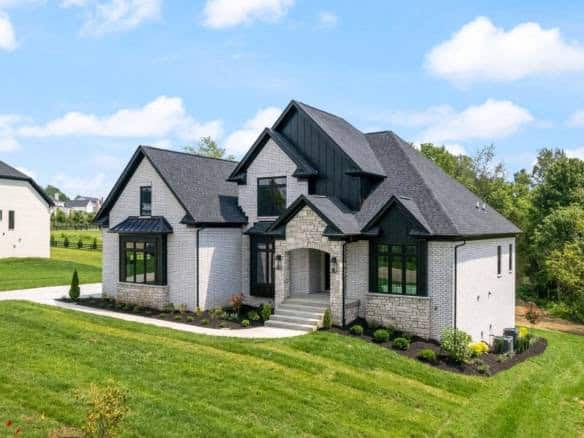 Beautiful modern house with black roof and white exterior at 11105 Craigs Creek Court.