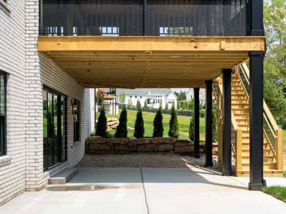 Elevated deck with wooden flooring and staircase at 11105 Craigs Creek Court.