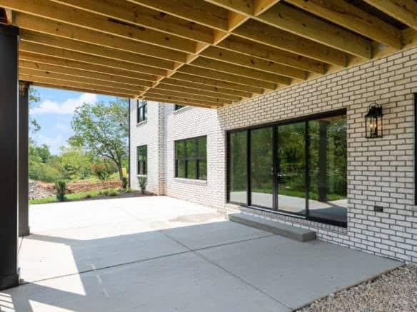 New construction patio with large sliding glass doors at 11105 Craigs Creek Court.