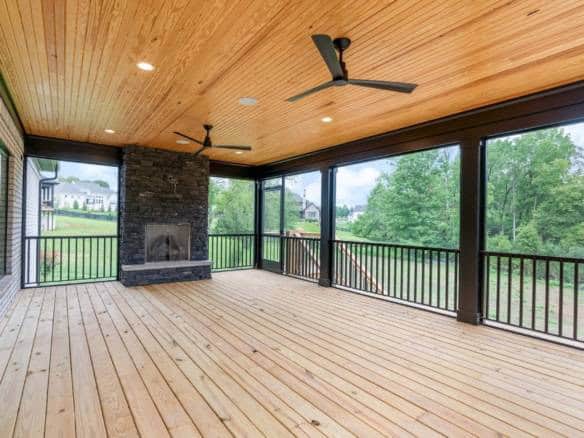 Modern screened porch with ceiling fans and scenic views at 11105 Craigs Creek Court.
