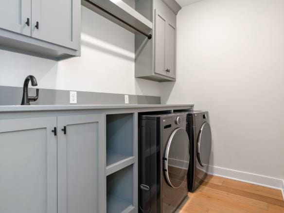 Laundry Room with Modern Cabinets and Appliances.