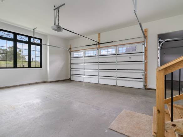 Garage with large window and automatic door opener at 11105 Craigs Creek Court.