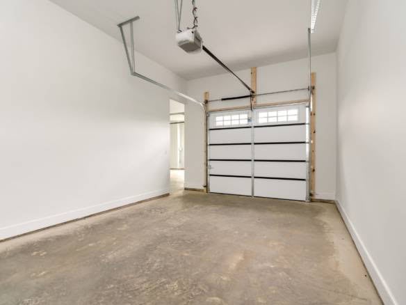 Garage interior with white walls and concrete floor at 11105 Craigs Creek Court.