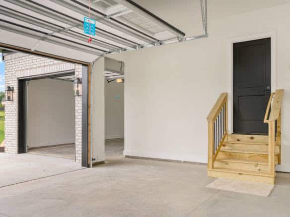 Garage with new door and interior entry door.