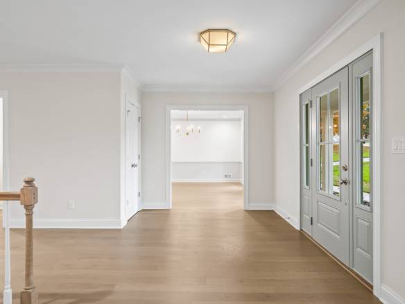 Interior view of a bright, spacious living area at 11714 Paramont Way. Featuring white walls, hardwo.