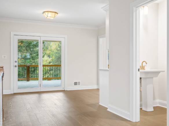 Interior view featuring a bright room with sliding glass doors leading to a deck.