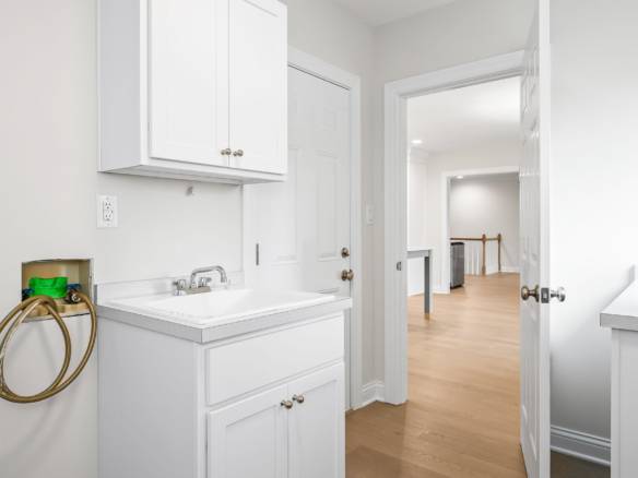 Interior view of a renovated laundry room at 11714 Paramont Way.