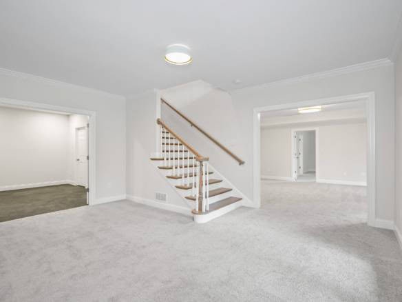 Interior view of a spacious, newly renovated home at 11714 Paramont Way. Bright, neutral walls and p.