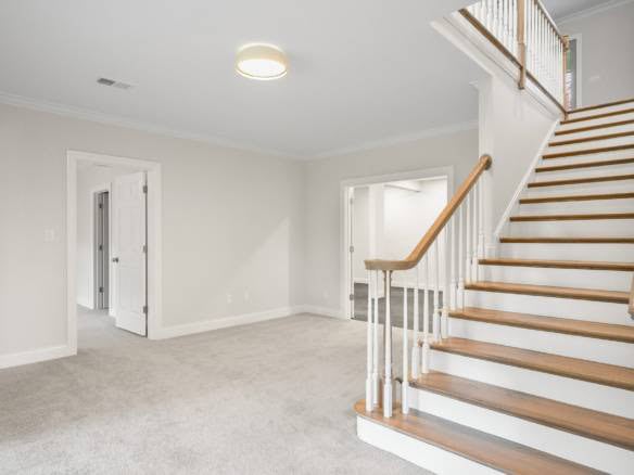 Interior view of a new home with a staircase and neutral-colored walls at 11714 Paramont Way.
