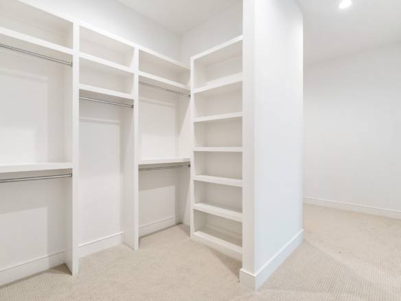 Spacious walk-in closet with built-in shelves and hanging space, part of the home at 3979 Hidden Fal.