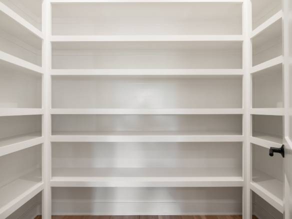 Custom closet with white shelving at 6307 Leyton Court for organized storage solutions.