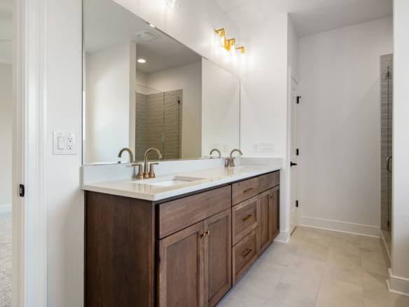 Elegant bathroom vanity with dual sinks and modern fixtures.