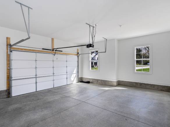 Garage with white walls and concrete floor at 6307 Leyton Court.