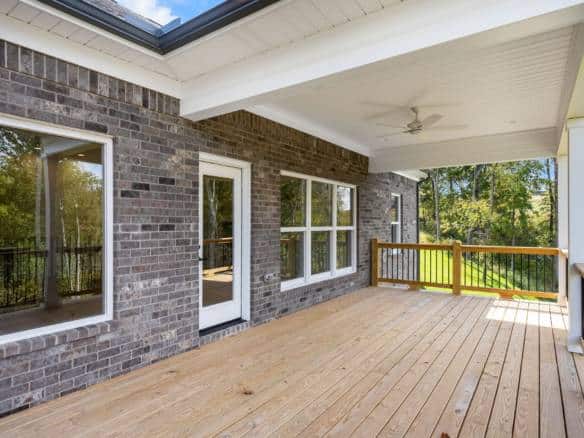 Porch with large windows and a spacious wooden deck at 6307 Leyton Court.