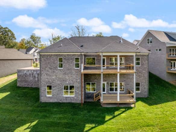 New construction home at 6307 Leyton Court with spacious decks and brick exterior.