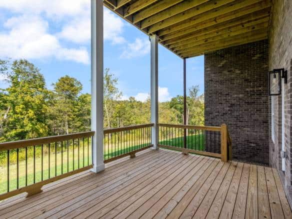 Balcony view from 6307 Leyton Court with wooden flooring and railing.