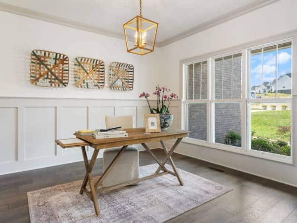 Modern home interior with large window and stylish decor.