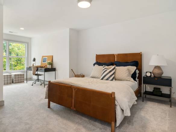 Bedroom with large window and contemporary decor at 6308 Leyton Court.