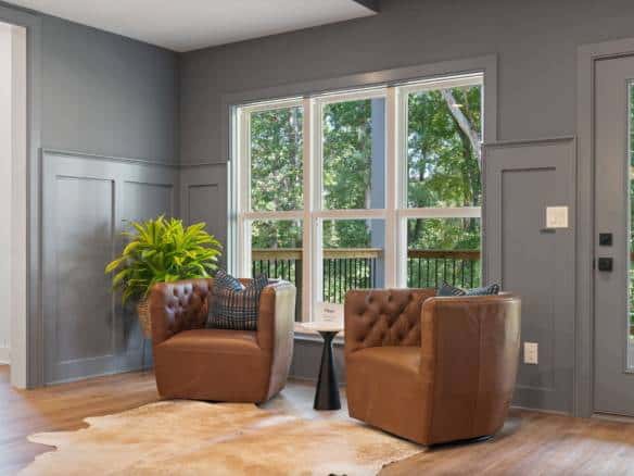 Bright living room featuring large windows and modern decor.