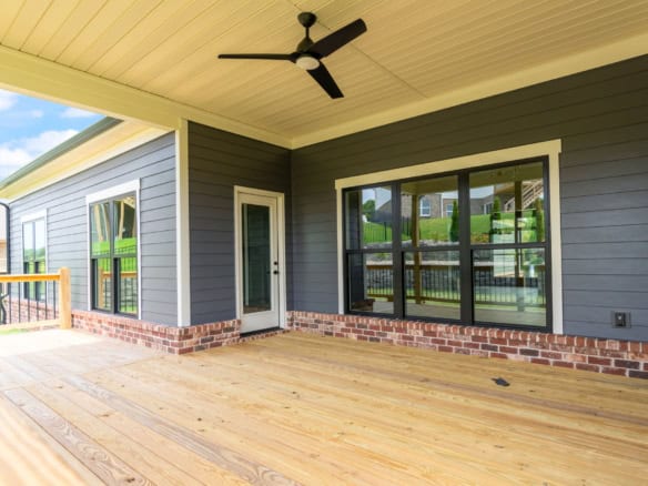 Modern screened porch with ceiling fan at 6209 Brentwood Dr.