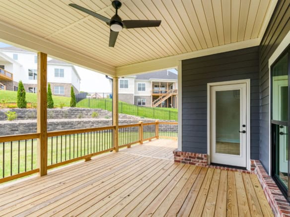 Outdoor living space with durable wood deck and railing.