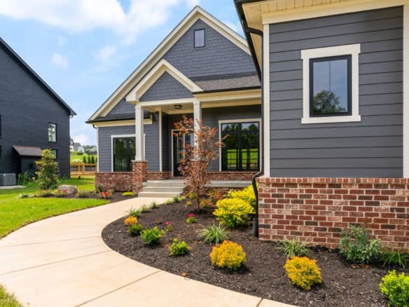 Beautiful new construction home with stylish exterior and landscaped yard. Perfect blend of curb app.