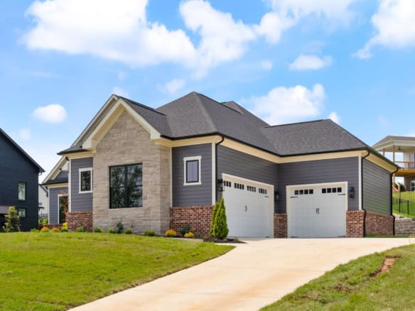 Modern Brentwood home with a spacious double garage and landscaped yard.