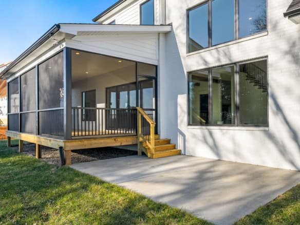 Beautiful screened porch addition for outdoor living and relaxation.