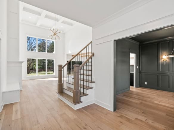 Modern interior with bright, spacious living area and staircase at 6286 Clore Lane.