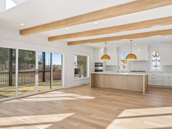 Bright, spacious kitchen with large windows and natural light.