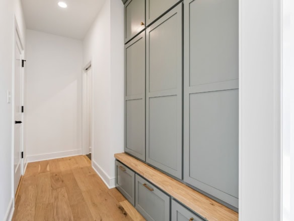 Built-in storage cabinet with gray finish at 6286 Clore Lane, featuring ample storage and a wooden b.