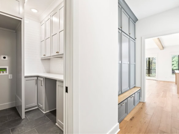 Bright, modern interior of a Clore Lane home with white cabinetry and natural light.