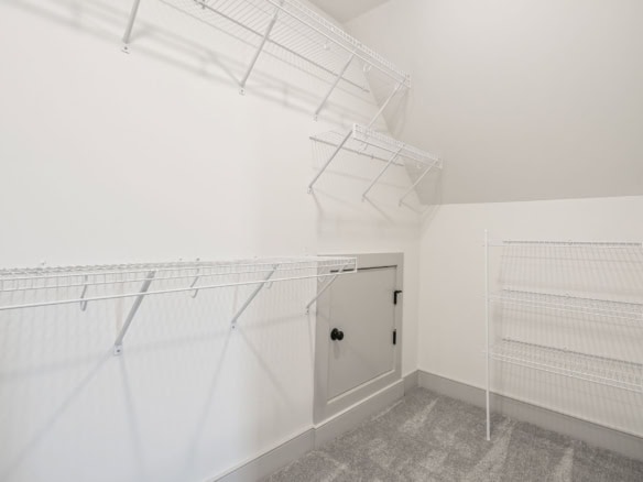 Closet storage with wire shelving and built-in cabinet.