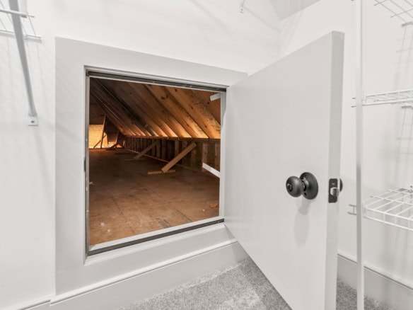 Attic access hatch in a clean, modern home.