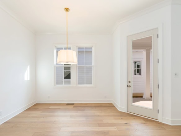 Bright, modern interior with large windows and hardwood floors.