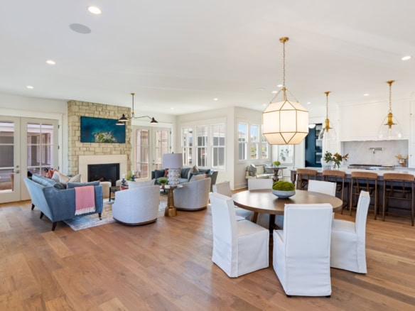 Bright, spacious living room with large windows and stylish furnishings.
