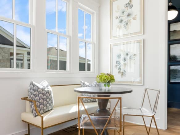 Bright interior dining space with large windows and modern decor.