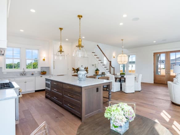 Bright, spacious open-concept kitchen and living room with modern decor.