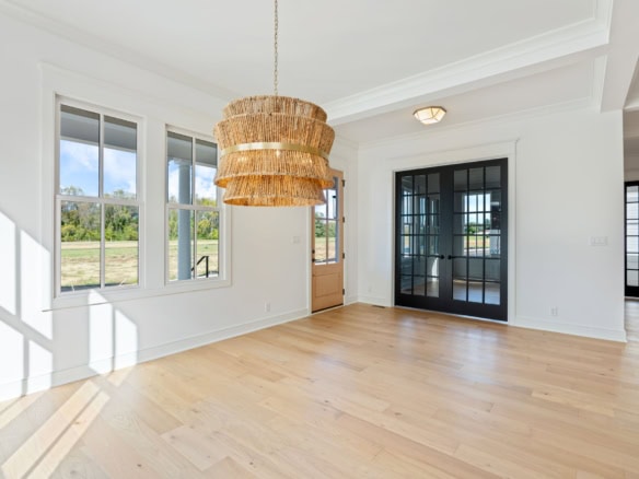 Bright, spacious living room with large windows and natural light.