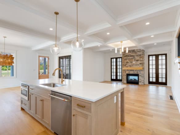 Spacious kitchen with island, bright living area, and fireplace at 11612 Skypilot Street.