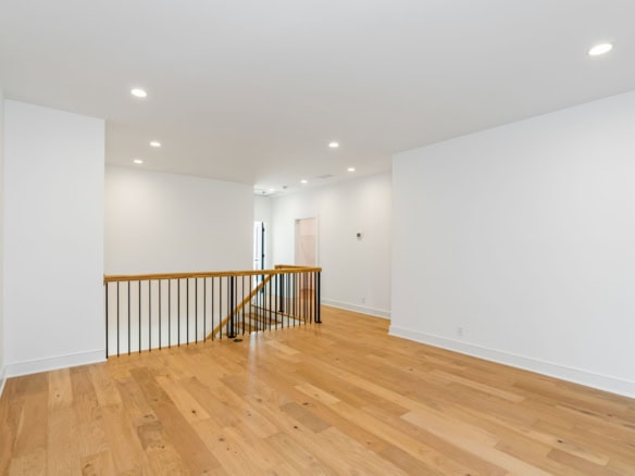 Bright, spacious interior with white walls and hardwood floors at 11612 Skypilot Street.
