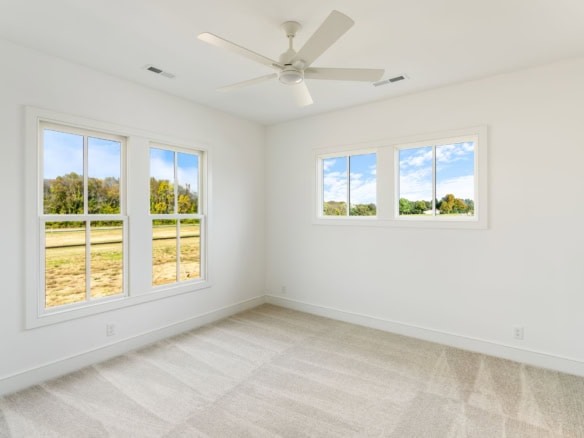 Bright, modern interior with large windows and white walls.